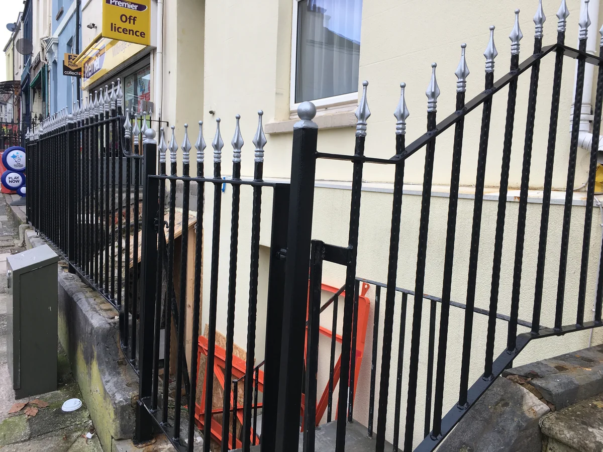 Restored period railings on an older Kingsbridge property